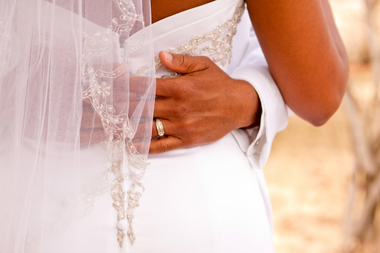 happy couple embraces on their wedding day