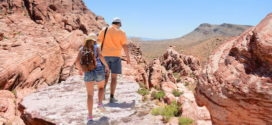 two hikers hike in Red Rock Canyon Park